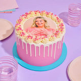 Edible Image Photo Cake with personalised edible photo, pink drip, and cream piping by Crumbs & Doilies.